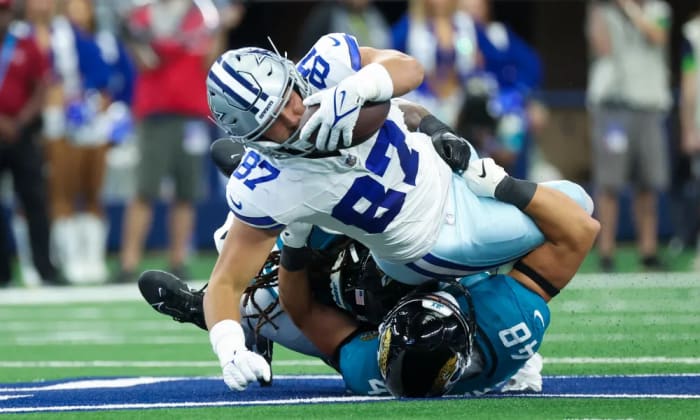 Ferguson getting tackled after a catch against the Jacksonville Jaguars.
